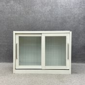 A contemporary steel industrial style sideboard or cabinet with two mesh laminated glass sliding