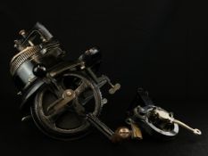 A late Victorian cast iron circular sock knitting machine with gilt decoration possibly by Imperia