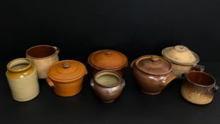 A collection of 19th century and later stoneware urns, crockpots with covers and French confit jars,