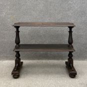 A 19th century ebonised pine etagere having a rectangular thumb moulded top with a matching lower