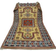 A large hand woven pure wool Turkish Elmaz carpet having all-over geometric patterns in iron red,