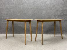A pair of contemporary oak console tables by Swoon Editions, each having a rectangular top raised on