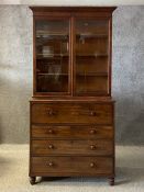 A Victorian mahogany library secretaire bookcase having a moulded cornice with a crossbanded