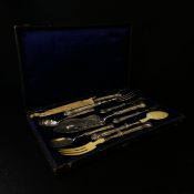 A 19th century French hallmarked silver carving and serving set with ivory fork and spoon heads, a
