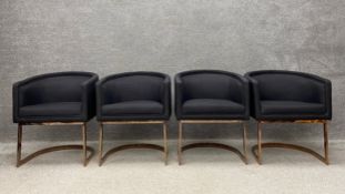 A set of four contemporary tub chairs each having a curved back and arms over a cushioned seat
