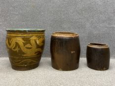 A Chinese planter or jardiniere of baluster form having an everted turquoise rim over a glazed ochre