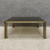 A 1970's square chrome and brass coffee table with smoked plate glass top. H.35 W.86 D.84cm