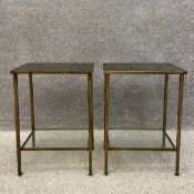 A pair of 20th century side or lamp tables each having a rectangular smoked glass top set into a