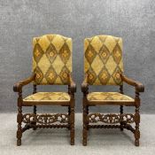 A pair of 19th century Carolean style oak throne chairs each having a high shaped back reupholstered