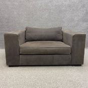 A large contemporary loveseat by Collins and Hayes of cuboid form with a cushioned back and seat