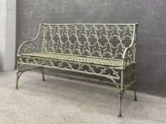 A heavy 19th century painted cast iron openwork Gothic Revival garden bench in the manner of