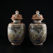 A pair of contemporary lidded Italian Chinoiserie decorated vases of baluster form each hand painted