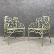 A pair of heavy 19th century painted cast iron openwork Gothic Revival garden armchairs in the