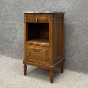 An early 20th century French walnut bedside cabinet having a square marble top over a single