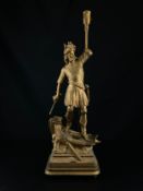A French cold painted spelter figural lamp depicting a soldier in classical military dress holding
