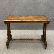 A 19th century walnut centre table having a marquetry inlaid and crossbanded top with a thumb