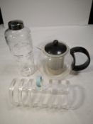A collection of mid century items to include a glass cocktail shaker, a glass teapot of globular
