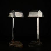 A near pair of French Art Deco table lamps each having a faceted sheet metal shade on a square