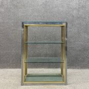 A mid to late 20th century Hollywood Regency style shelving unit or console having four