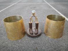 A 20th century equestrian themed novelty lamp having a brass horseshoe set above two small boots