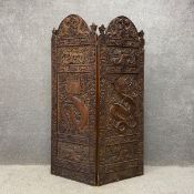 A 20th century Chinese hardwood screen or room divider comprised of two folding panels each having