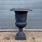 A C.1900 painted cast iron campana form urn having a wide flared rim over a shaped body with a