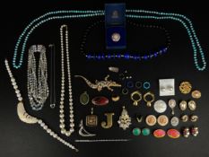 A miscellaneous collection of costume jewellery to include necklaces, earrings, brooches and bangles