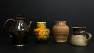 A mixed collection of 20th century studio pottery to include a dark brown iridescent glazed handmade