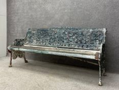 A 19th century painted cast iron openwork Nasturtium garden bench by Coalbrookdale with indistinct