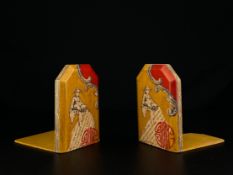 A pair of 20th century Chinese bookends each depicting a seated figure over the double happiness