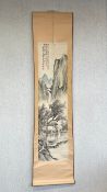 A 20th century hand painted Chinese scroll depicting a pagoda and trees on a mountainous landscape