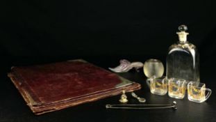 A collection of twelve items to include a 19th century miniature gilded glass decanter with three
