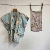 Two items to include an early 20th century Oriental cotton shawl decorated with a repeating white