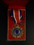 A 20th century Chinese Republic Order of The Brilliant Jade Fifth Class neck badge inset with a
