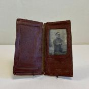 A 20th century leather wallet with an original portrait photograph of Charles Cantlie in traditional