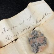A small fragment of red granite; possibly a piece of one of the ancient Egyptian obelisks referred