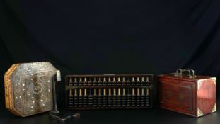 A collection of four Oriental items to include an early 20th century carved bone Mahjong set with