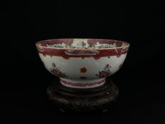 A large possibly 18th century Chinese Qianlong famille rose export porcelain bowl with a hand