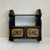 A 19th century Aesthetic Movement black lacquered Chinoiserie wall cabinet having an open top