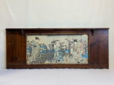 A 19th century wall mounted hardwood and bamboo shelf with a glazed panel displaying a triptych of