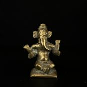 A 19th century Indian school brass figure depicting Ganesh. H.8.5cm