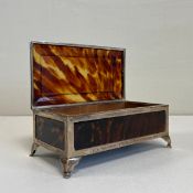 A mid century silver mounted faux tortoiseshell footed trinket box having a stepped caddy topped lid