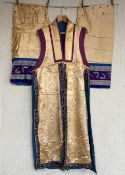 A late Qing or early Republic period Chinese gold silk robe with detachable arms possibly for