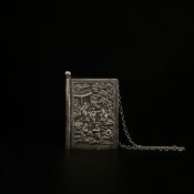 A 20th century repoussé white metal notebook cover by Sampson Mordan & Co. chased with Oriental