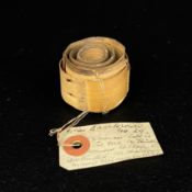 A small naturally sprung bark or reed coil worn by Tamil tribeswomen to stretch their ear lobes