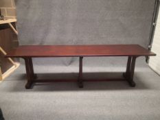 A mid 20th century teak refectory table in the Arts and Crafts style having a rectangular top raised