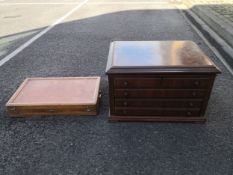 A 20th century walnut cutlery box having a moulded hinged lid opening on to a mirrored and fitted