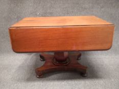 A mid 19th century mahogany dropleaf Pembroke table having a square thumb moulded top with a