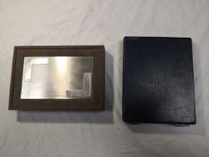 Two items to include a boxed set of US dollar bill gambling chips together with a bronze plaque