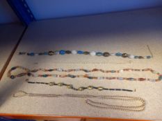 A collection of five miscellaneous beaded and pearl necklaces.